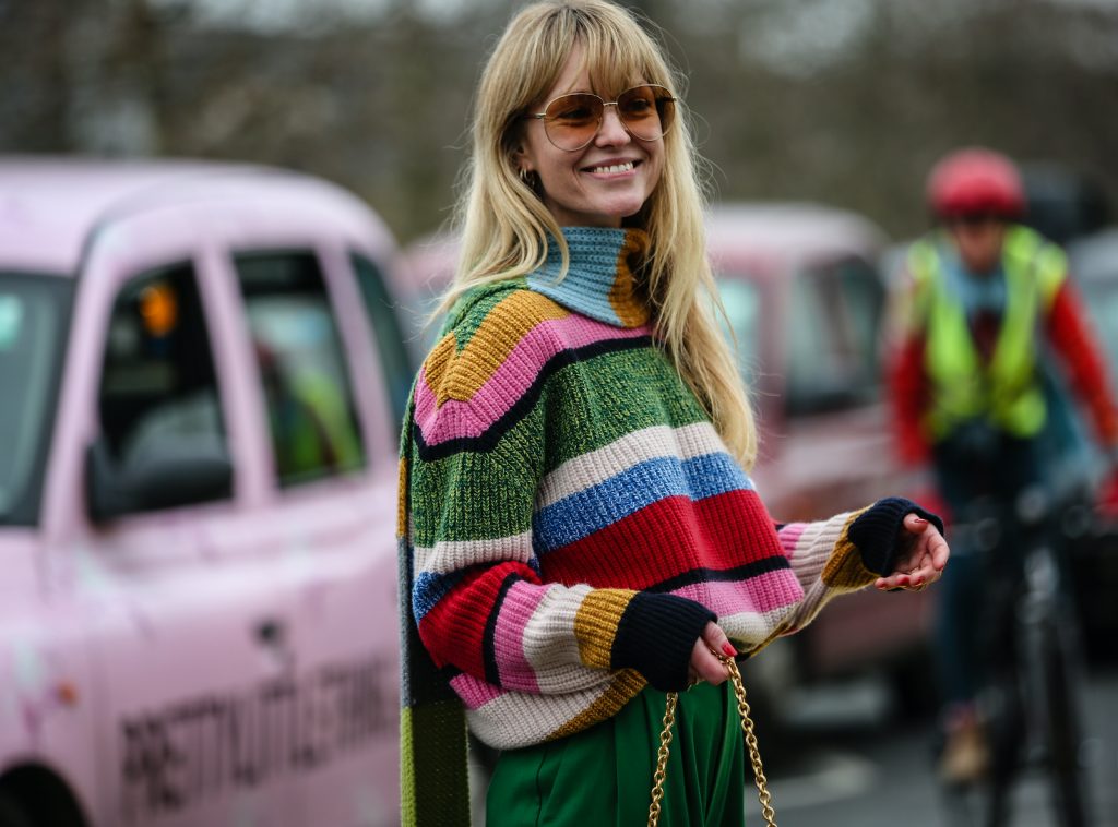 Woman wearing a colourful jumper