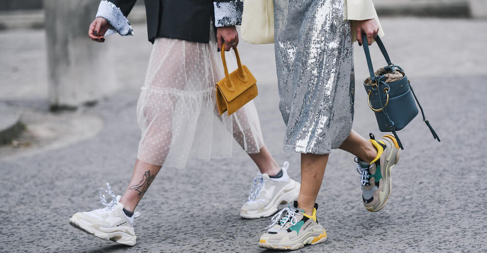 women walking down the street at Paris Fashion Week