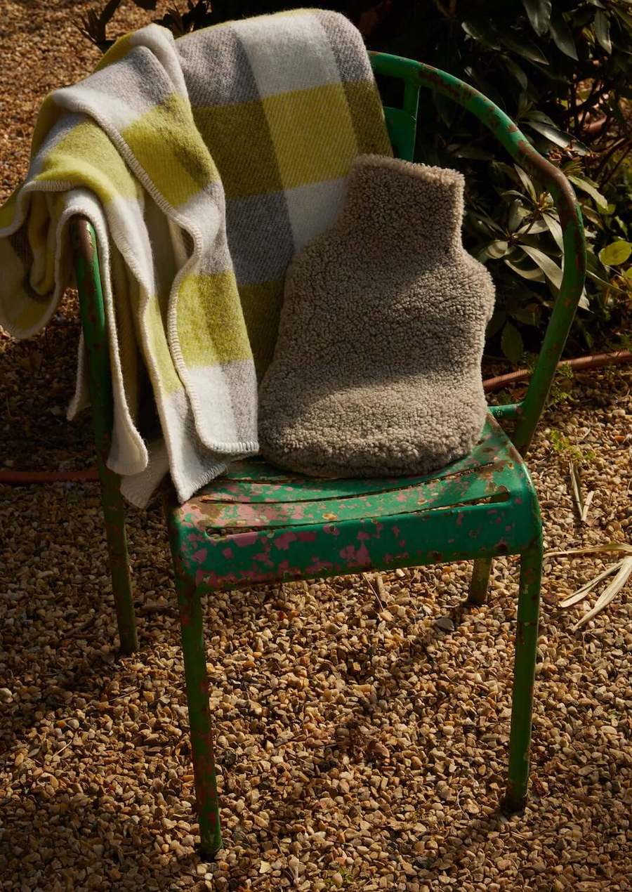 hot water bottle sits on a green chair