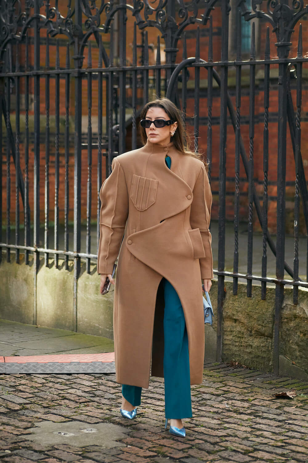 woman wears tan coat at london fashion week street style