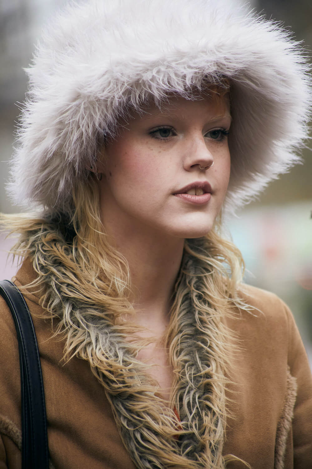 white blonde woman at london fashion week wears a bucket hat