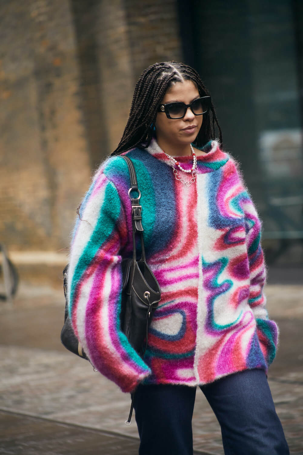 woman wears printed jumper at london fashion week