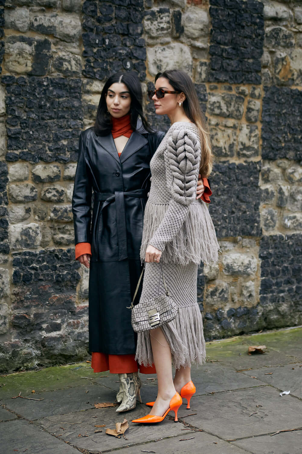 two women wear heels at london fashion week