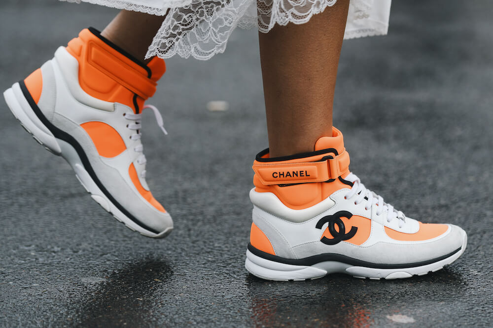 Woman wears Chanel trainers