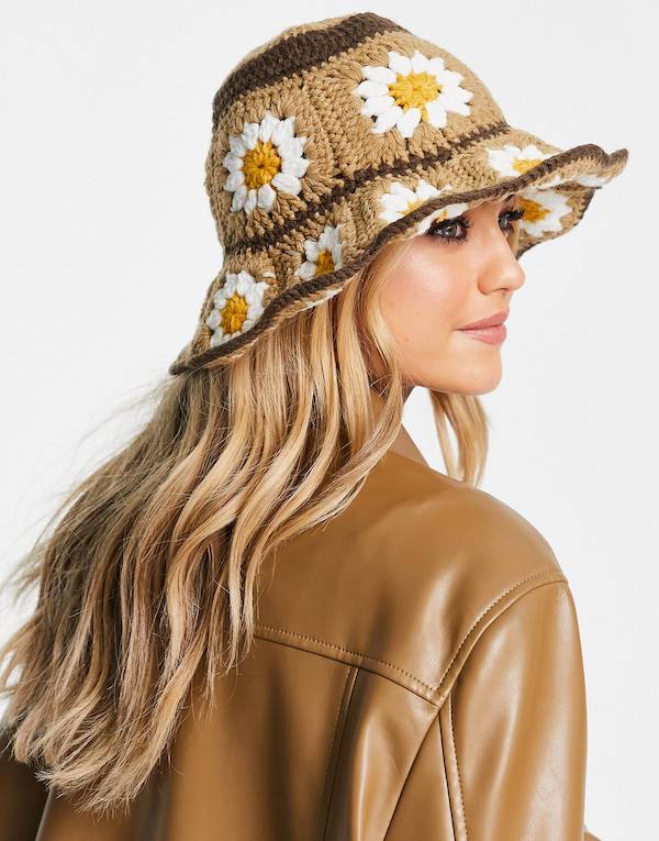 ASOS DESIGN crochet bucket hat with daisy detail in brown