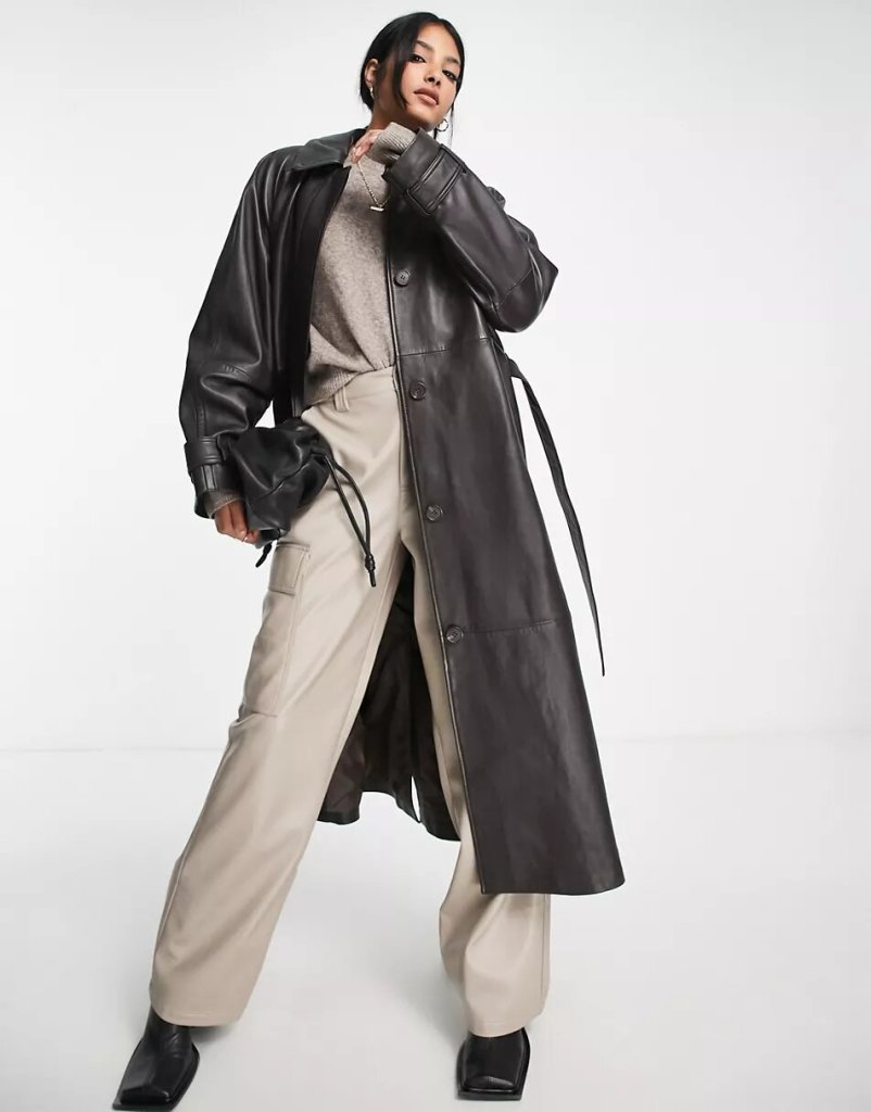 model wearing a brown leather trenchcoat from asos