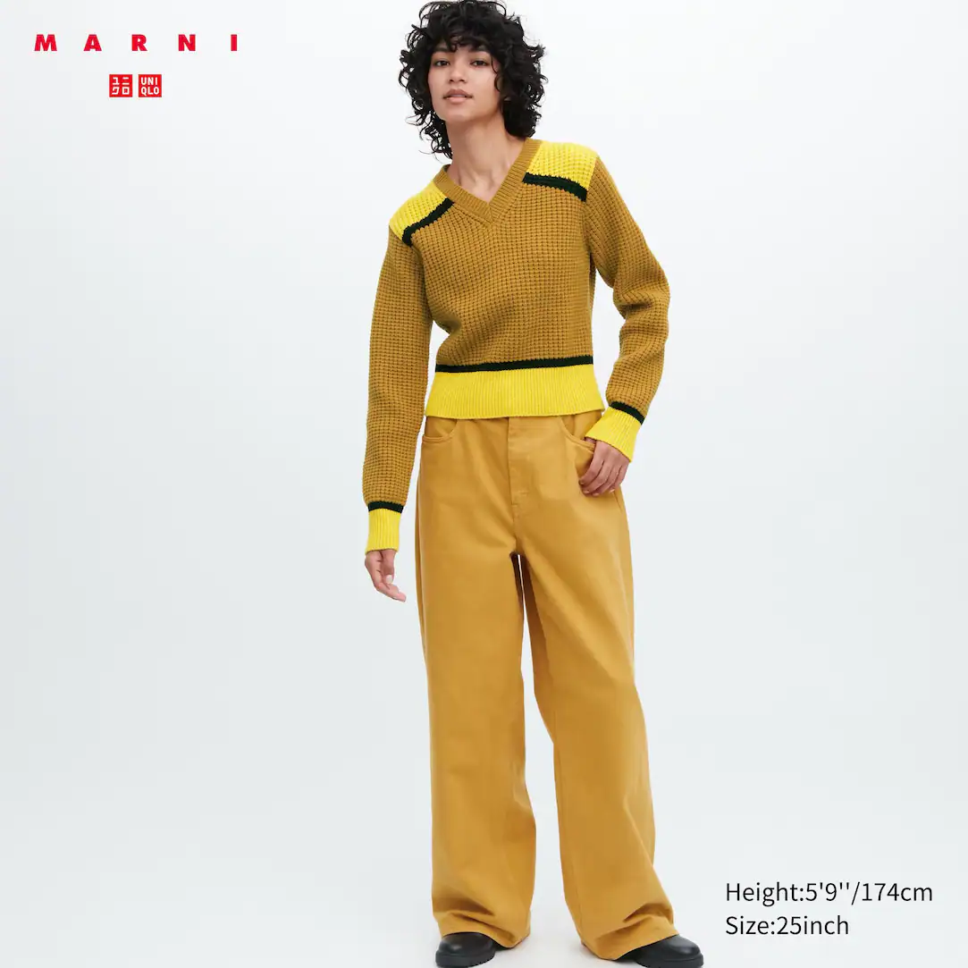 model wearing the Marni Baggy Jeans with yellow sweater