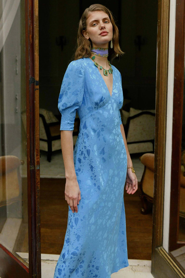 Rixo model wears the Zadie V-Neck Midi Dress in Blue Leaf Jacquard