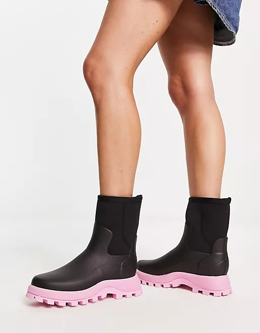 City Explorer short boot in black with pink sole from Hunter on ASOS  