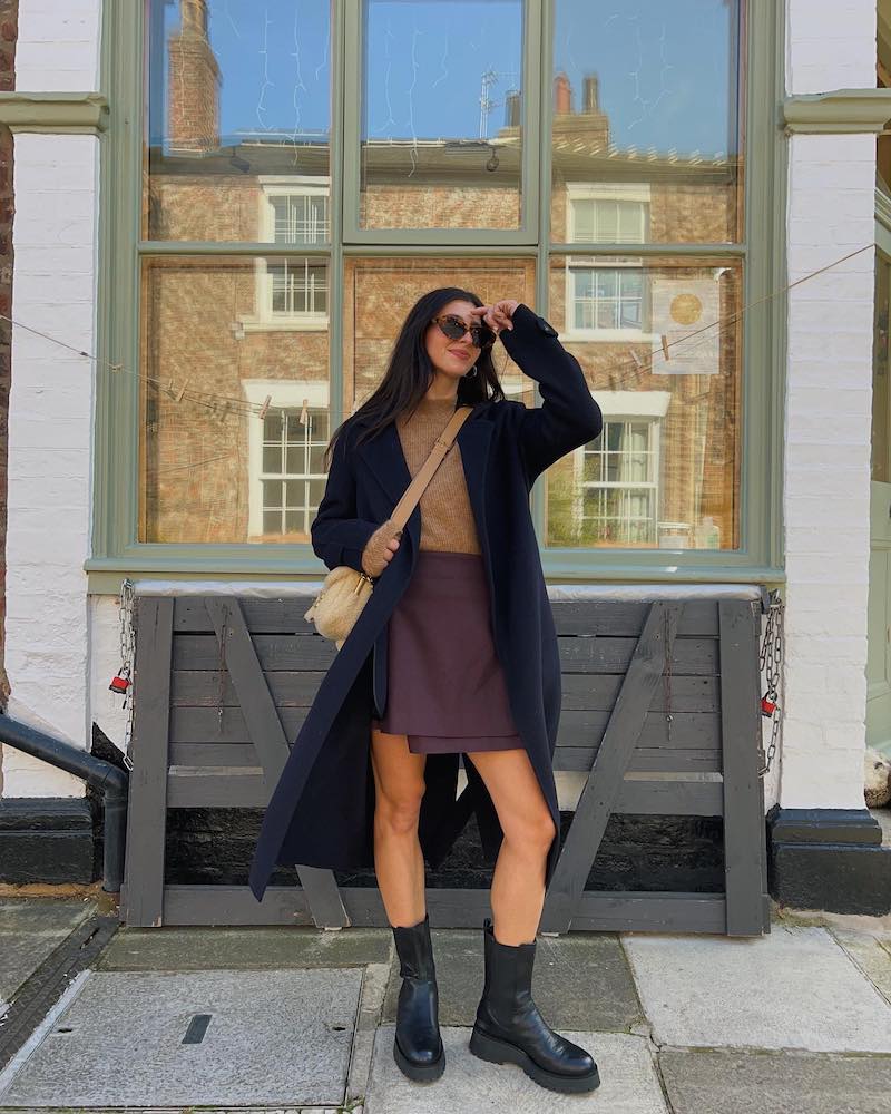 Franki Dammone wearing a pre-loved burberry pleated skirt and jumper